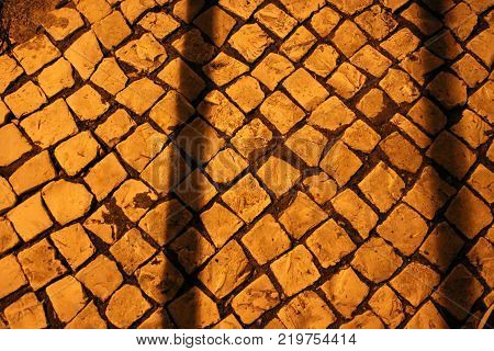Porphyry Tiles At Night In Lisbon Portugal