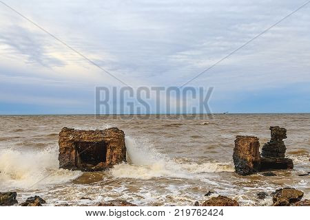 Waves beating against Latvia.Liepaja.Karosta. described the fortress ruins