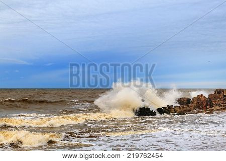 Waves beating against Latvia.Liepaja.Karosta. described the fortress ruins