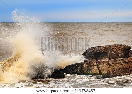 Waves beating against Latvia.Liepaja.Karosta. described the fortress ruins