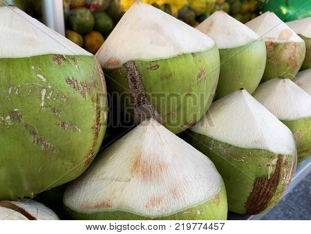 Pile of Semi-Peeled Coconuts Ready to Drink