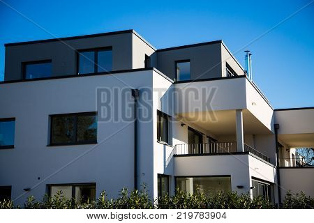 modern multi family house in munich blue sky