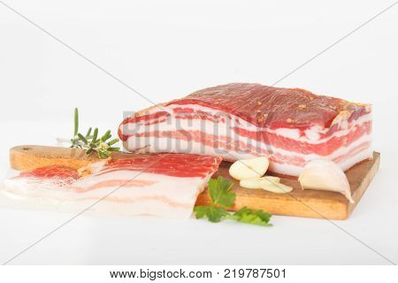Bacon. Smoked bacon with herb, salt, pepper and garlic. Stll life studio shot.