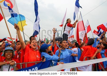 KRAKOW POLAND - 2016: Krakow Blonia World Youth Day 2016 People greet Pope