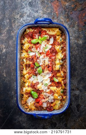 Cannelloni con ricotta e salca di Pomodoro as top view in a roasting pan