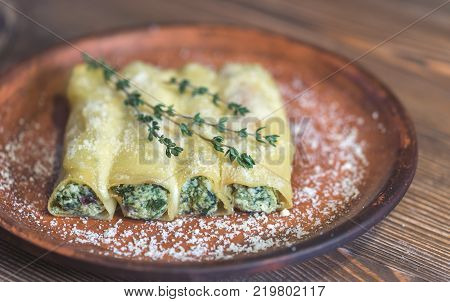 Canelloni stuffed with ricotta and spinach on the plate