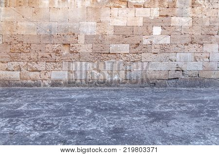 Castle cement floor with yellow rugh pattern stone block from ancient structure texture