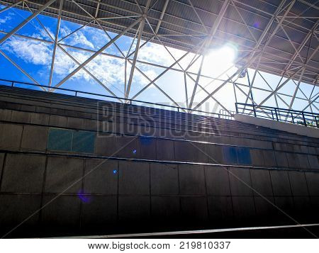 Snd and Sky in space between the grandstand and roof