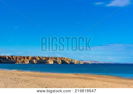 Picturesque beach landscape with sand and spectacular cliff coastline. Maslin beach, South Australia, Australia