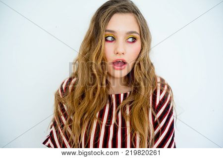 A portrait of a teen girl model in a stdio