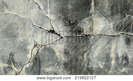 Old vintage cement messy cracked wall, grunge brick textured background, panoramic photo