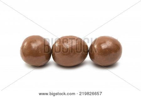 chocolate dragee balls isolated on white background