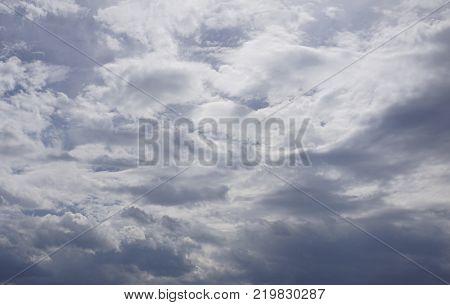 hovers above the sand gloomy the clouds of Heaven