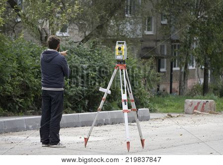 a worker stands next to the level