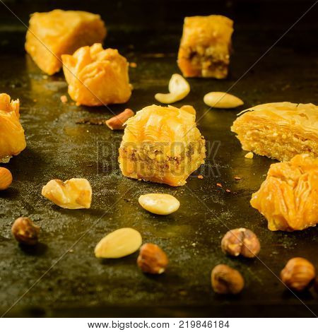 Sweet turkish and arabian Baklava with honey and almond on tablet