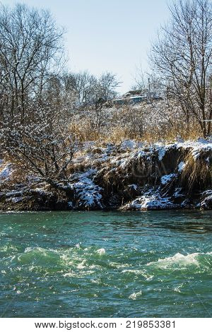 River in Winter. Rapids of Stormy River. Winter Landscape