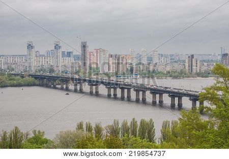 Aerial top view of Paton bridge and Dnieper river from above, city of Kiev, Ukraine