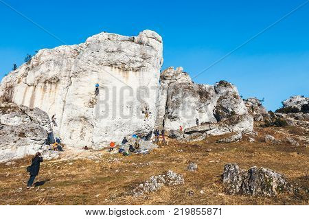 Poland Podlesice - March 04 2017: rock climbers on vertical flat wall. Gora Zborow is a very popular destination among climbers
