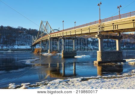 Evening view to Pedestrian bridge and Arc of a friendship of a nations in Kiev