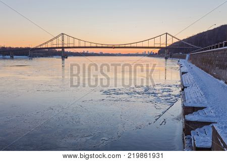Evening view to Pedestrian bridge and Arc of a friendship of a nations in Kiev
