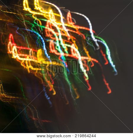 Empty wooden table with abstract blur christmas tree and snow falling background bokeh Holiday backdrop Mock up banner for display of product for promotion