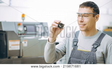 quality control part metal worker machine male