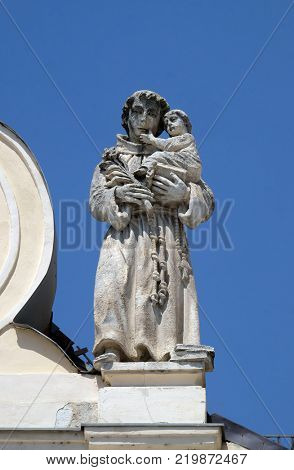 CAKOVEC, CROATIA - JULY 02: Saint Anthony of Padua statue on the top of Parish Church of Saint Nicholas in Cakovec, Croatia, on July 02, 2016.