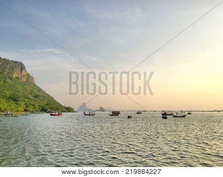 Many ships on the seawaves inthe twilight time in Thailand sea.