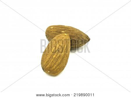 closeup almond nuts isolated on white background of file with Clipping Path .