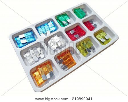 Box of colorful fuses for auto on white background