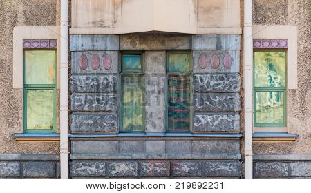 Several windows in a row on the facade of the urban historic building front view, Saint Petersburg, Russia