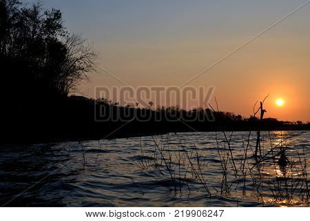 A beautiful Lake during sunset with the lake in the foreground and sun in the back