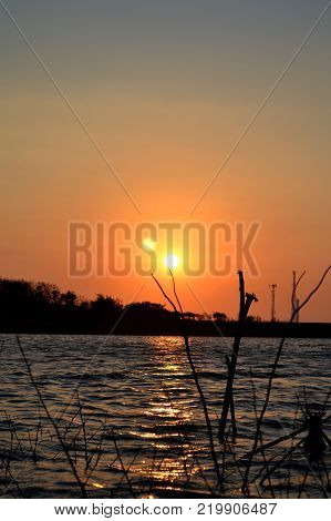 A beautiful Lake during sunset with the lake in the foreground and sun in the back