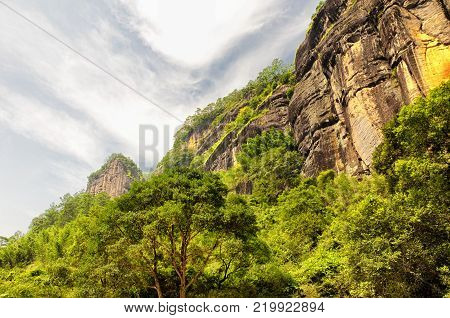 Rock formations lining the nine bend river or Jiuxi in Wuyishan or Mount wuyi scenic area in Wuyi China in fujian province