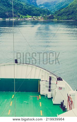 Tourism vacation and travel. Mountains landscape and fjord in Norway Scandinavia Europe. Norddalsfjorden as seen from ferry.