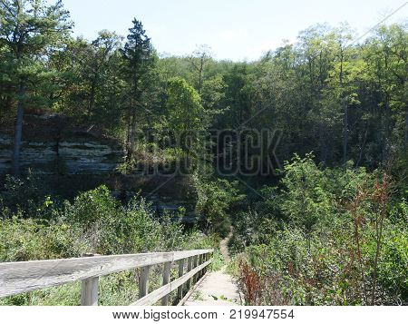 Limestone Cliff near the entrance from Utica, IL to Starved Rock State Park viewed from trail
