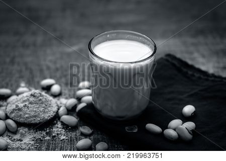 Close Up Of Ayurvedic Herb Kuanch,cowhage,mucuna Pruriens With Powder And Milk Glass.;