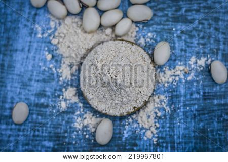 Close Up Of Ayurvedic Herb Kuanch,cowhage,mucuna Pruriens With Powder.