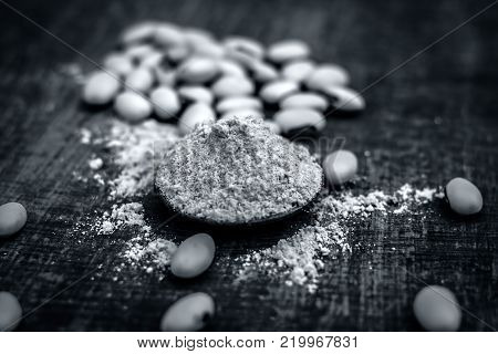 Close Up Of Ayurvedic Herb Kuanch,cowhage,mucuna Pruriens With Powder.