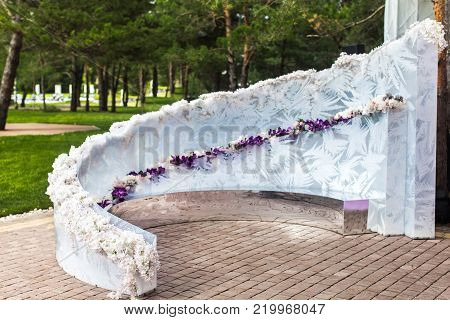 Outdoor wedding ceremony with umbrellas in the forest.