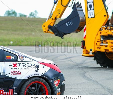 KIEV, UKRAINE - MAY 20: Ukrainian Drift Champion's Alex Grinchuk  Nissan 350Z and agricultural machine JCB , May 20, 2017, Aviafest at Chayka airfield in Kiev, Ukraine