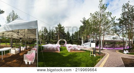 Outdoor wedding ceremony and banquet wedding tent.
