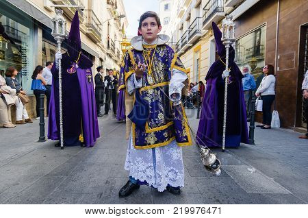 Badajoz Spain friday. april 14. 2017. altar boy in Holy Friday. Procession of Holy Week in Badajoz.