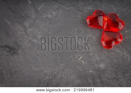 Red hearts on a gray background. The symbol of the day of lovers. Valentine's Day. Concept February 14