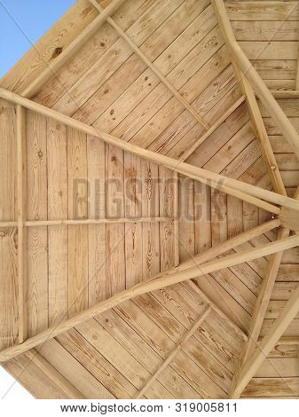 Close-up Of A Part Of A Wooden Beach Umbrella