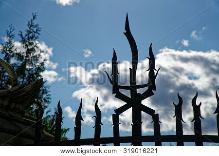 Weathered Metal Post Finials Trident Metal Fence For Protection Against Chimeras And Evil Power.