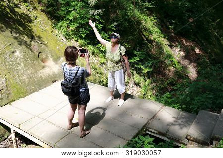 Woman Photographs Grandmother In Dantovo Gorge, Krasnodar Region, Russia