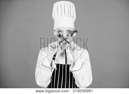 Lets Spoon It Out. Cook Forming The Sign Of Cross With Spoon And Fork. Pretty Woman Holding Dinner F