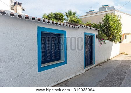 Walking On Traditioanal Greek Streets With White House, Spetses Saronic Gulf, Greece