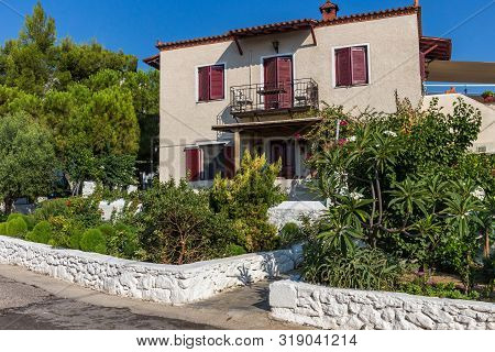 Walking On Traditioanal Greek Streets With White House, Spetses Saronic Gulf, Greece